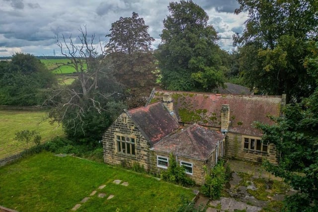 An overview of the property with potential, in its leafy location.