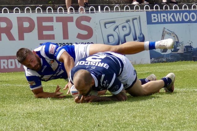 Luke Briscoe scores Featherstone Rovers' historic 12,000th try.