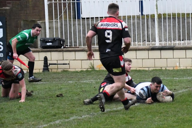 Joe Crossland dives over for the last minute winning try for Normanton Knights.