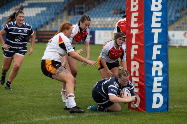 Zoe Teece dives over for a try.