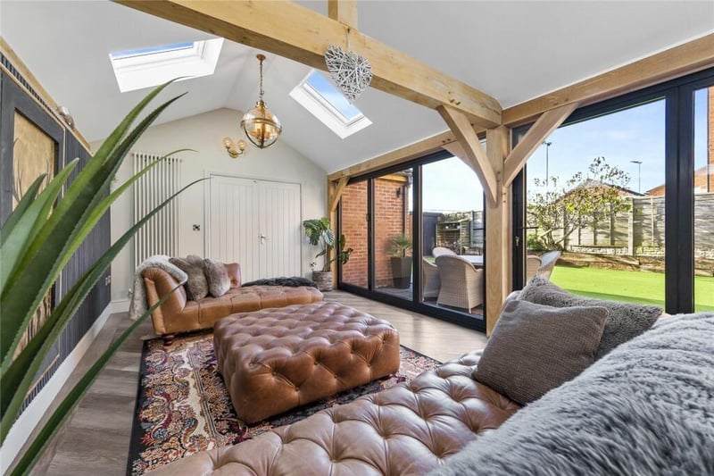 To the rear is a beautifully decorated garden room with bi-folding doors affording both natural light into the property and ease of access into the garden.