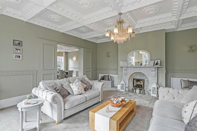 This light and airy room has a heavily moulded ceiling, a feature marble fire surround and hearth and central heating radiators.