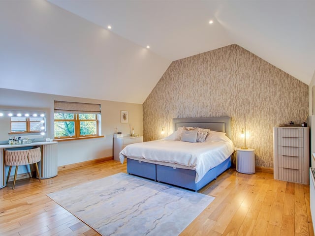 Bedrooms are spacious, and two have their own en suite shower rooms.