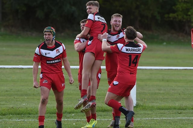 Jack Firth celebrates scoring a crucial try with his Fryston Warriors teammates. Picture: Matthew Merrick