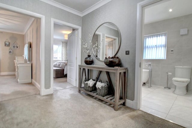 The spacious hallway gives access to three double bedrooms.