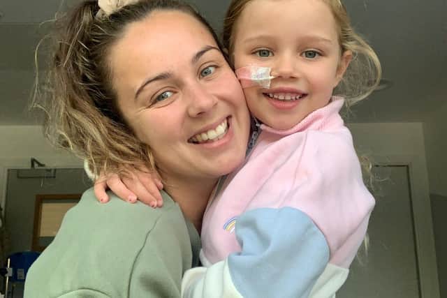 Pictured Penny Barraclough and mum Jodie Mangham. An adorable young girl with a rare genetic condition has gone viral on social media after recording cute dance routines with her nurses. See SWNS story SWLNdance. Penny Barraclough’s incredible moves and bubbly personality led millions to watch her Tik Tok clips - as she underwent a stem cell bone marrow transplant in hospital. The six-year-old was diagnosed with congenital amegakaryocytic thrombocytopenia (CAMT),  which left her “head to toe” in bruises and stopped her blood from clotting. And after she suffered bone marrow failure, doctors first gave her chemotherapy before she had the transplant operation at Sheffield Children's hospital in September. But fearless Penny didn’t let the dangerous illness ruin her fun during her six weeks on the ward, and instead recorded videos that won her admirers from as far as Australia. And one of her clips, where she performed a catchy routine with a staff nurse, even racked up nearly eight million views on the social media app alone. Penny’s mum Jodie Mangham, 30, who helped her record the videos, said the cheeky little girl had turned a “heart-breaking” situation into a "positive" one. 