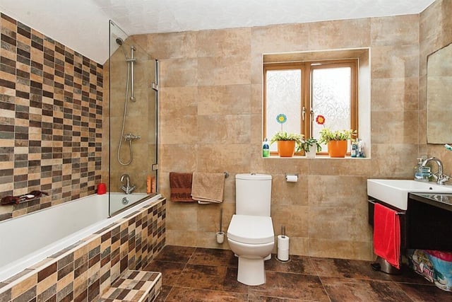 The modern tiled house bathroom.