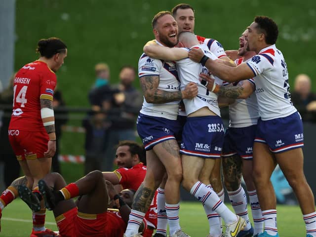 Wakefield Trinity's Josh Griffin celebrates with teammates after scoring a try at Sheffield. Picture by John Clifton/SWpix.com