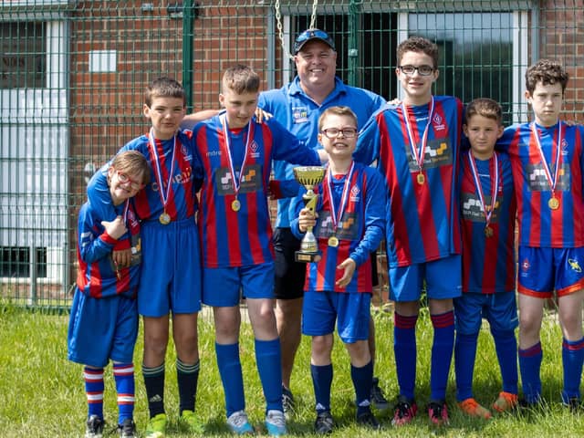 WINNING TEAM: Thornes Strikers U12s with coach Neil Brown. Picture: Mark Parsons