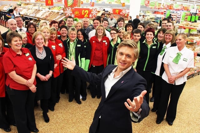 Former G4 singer Jonathan Ansell visiting Asda, Sandal in 2009 to say thank you for all the money they have raised for breast cancer.