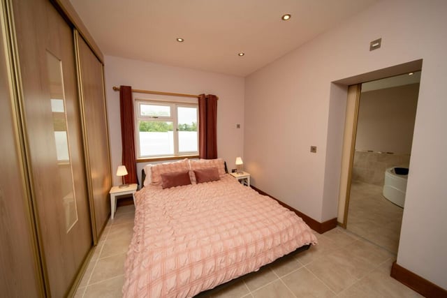One of the property's bedrooms with an en suite facility.