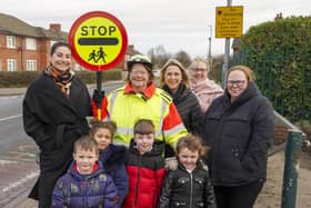 Pupils, staff and parents at Common Road Infant & Nursey School with Brenda Wood who has retired as their Lollipop Lady. Picture Scott Merrylees