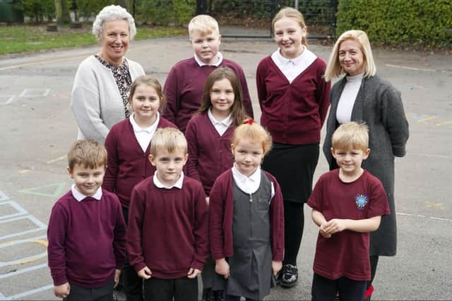 Headteacher Sally Henshall, Deputy Head Helen Reed and pupils celebrate a 'Good' rating by Ofsted at South Hiendley Primary School. Picture Scott Merrylees