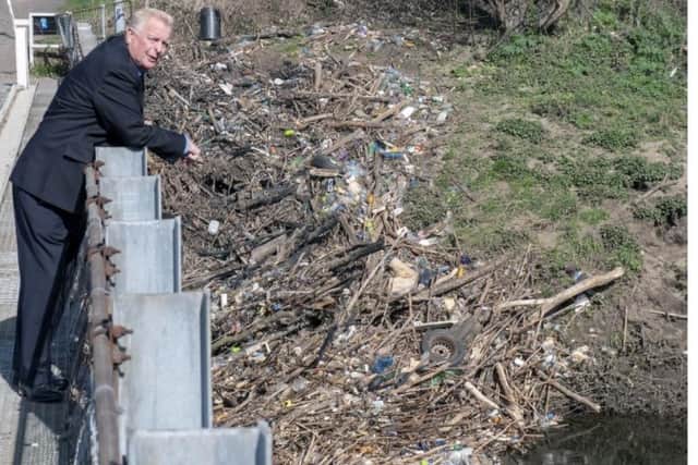 Paul Dainton, president of Residents Against Toxic Scheme (RATS), pictured in 2019 with plastic waste piled up at Stanley Ferry. He said he waste had floated down from Welbeck tip