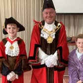 The Mayor of Wakefield, Coun David Jones with pupils Aiden Carritt dressed in ceremonial robes and his sister Emily Carritt, dressed in pyjamas.