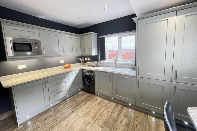 The breakfast kitchen is fitted with shaker style units with granite worktops and breakfast bar.