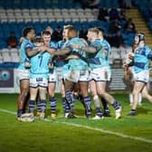 Celebration time for Featherstone Rovers players as they congratulate try scorer Thomas Lacans in the 16-12 pre-season win over Bradford Bulls. Picture: JLH Photography