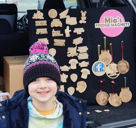 Mia Britton at Thorpe Arch car boot and indoor market. She sells her own handmade laser-engraved fridge magnets
