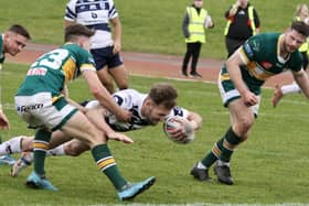 Featherstone Rovers skipper Ben Reynolds forces his way over for a try in the opening AB Sundecks 1895 Cup tie at Hunslet. Picture: Kevin Creighton