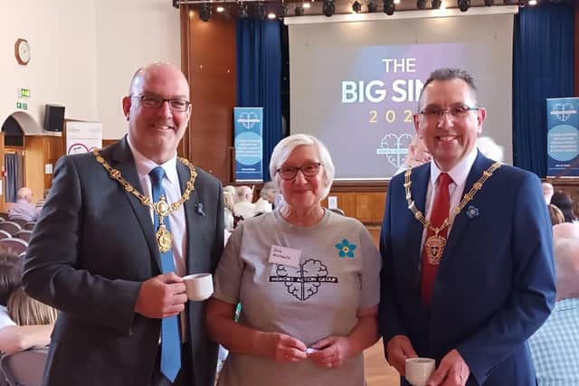 Jan Archbold, founder of the Memory Action Group, at the Big SIng in aid of the Alzheimer's Society with Deputy Mayor of Wakefield Councillor Darren Byford and his husband, Peter Davis.