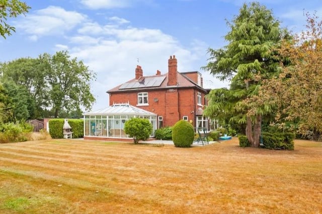 This 7 bed detached house is on Aberford Road, Stanley on a plot spanning approximately 1.35 acres. The home is set over three  floors and approximately 5000sqft in total and contains 7 bedrooms with 5 bath/shower suites and 2 additional toilets, 5 reception areas a kitchen and a utility room. There is also an integral double garage and a detached double garage. It's for sale for £1,300,000.