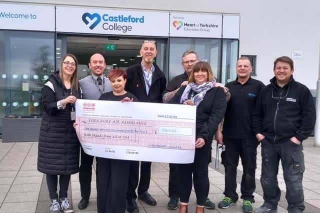 Stephanie Maynard, the West Yorkshire Community Fundraiser from Yorkshire Air Ambulance presenting Castleford College staff with their cheque