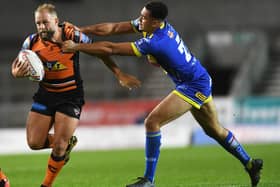 Luis Johnson in action against Castleford Tigers as he comes up against his new skipper, Paul McShane.