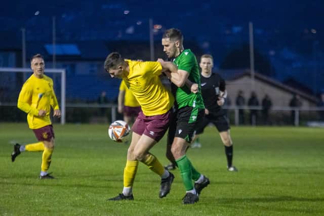 Emley's Joe Clegg holds the ball up against Golcar. Picture: Mark Parsons