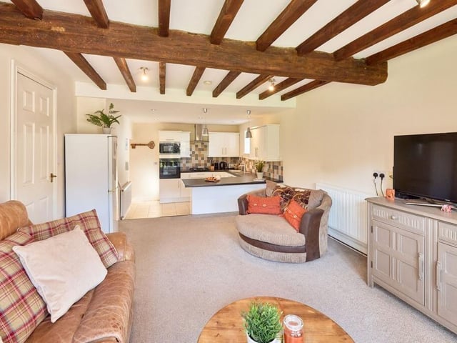 Below the gym, additional living accommodation can be found in what was once an old pigsty which features the original timber beams in the lounge.