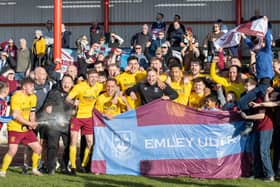 Emley players and staff celebrate their NCE League title success. Picture: Mark Parsons