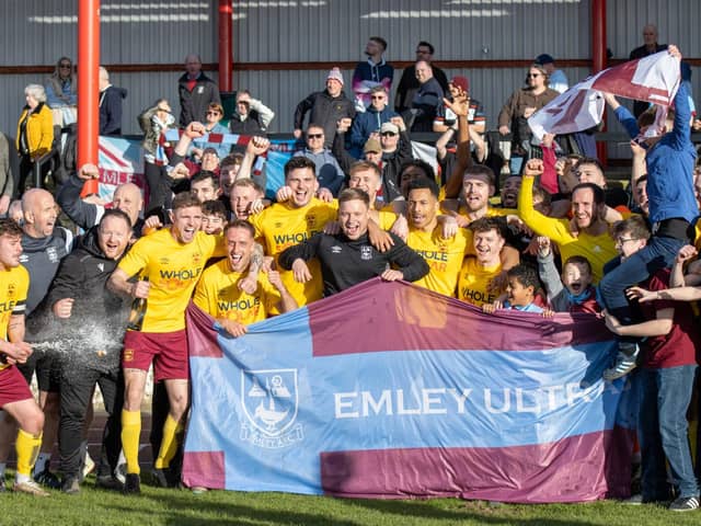 Emley players and staff celebrate their NCE League title success. Picture: Mark Parsons
