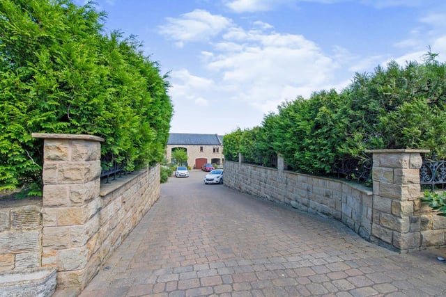 The private driveway leads in to the front courtyard.