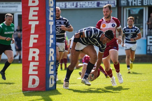 Arama Hau about to touch down for one of his two tries.