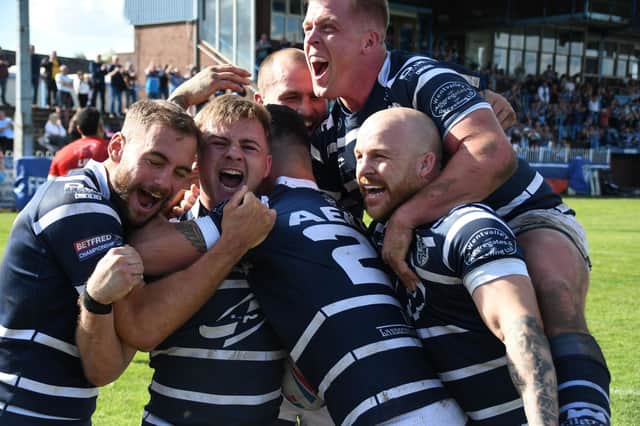 Featherstone Rovers players gleefully celebrate Caleb Aekins' winning try against Sheffield Eagles, which came in the 79th minute. Picture: Rob Hare