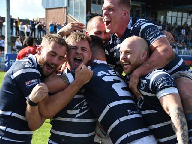 Featherstone Rovers players gleefully celebrate Caleb Aekins' winning try against Sheffield Eagles, which came in the 79th minute. Picture: Rob Hare