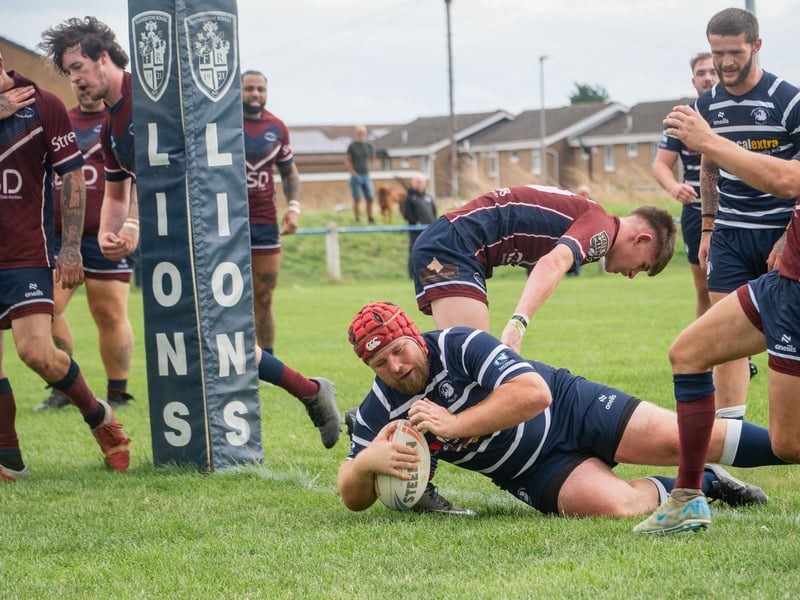 No stopping Luke Cooper as he powers over under the sticks for a Featherstone Lions try.