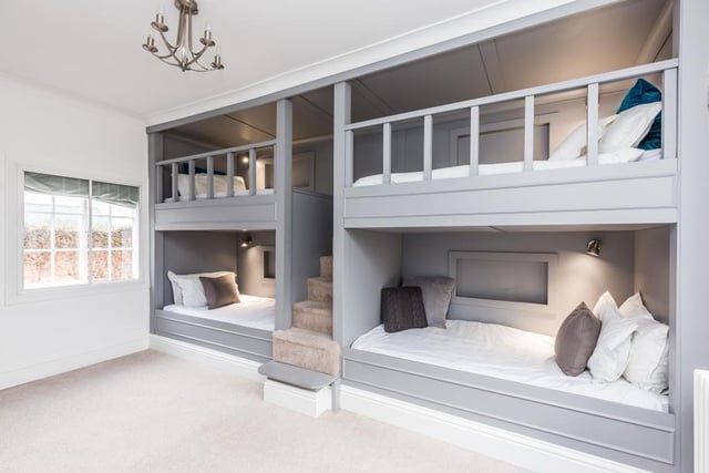 Four bespoke bunk beds are within this bedroom that is accessed from a half-landing to the first floor.