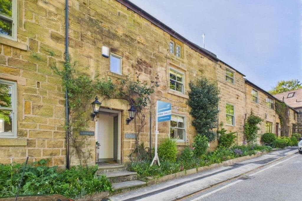 Inside quaint three-storey stone cottage for sale in rural village