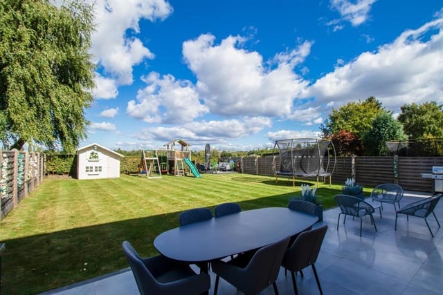There is an attractive lawned garden, a timber decked patio area and timber panelled surround fences on two sides and privet hedge at the rear with open aspect rural views over the fields behind.