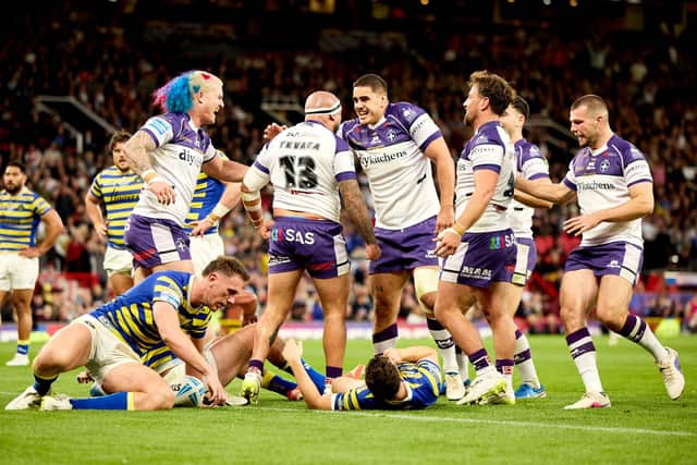 Trin celebrate. Photo by John Clifton.