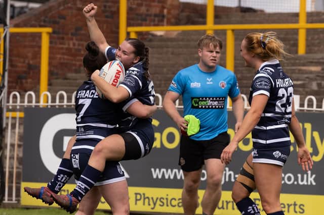 Ella Johnson celebrates scoring a try for Featherstone Rovers Women against Castleford Tigers Women. Photo by John Victor