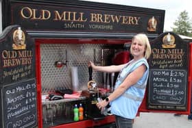 Keeley pulling a pint at last year's Kirklands FC charity football day.