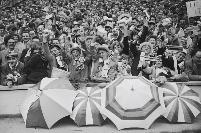 Wakefield Trinity supporters in the crowd during the Challenge Cup final between Wakefield Trinity and Huddersfield at Wembley Stadium in 1962. Wakefield Trinity won the match 12-6. (Photo by Evening Standard/Hulton Archive/Getty Images)
