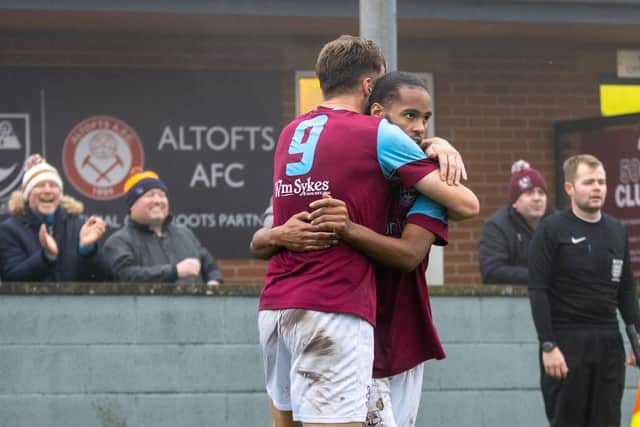 Joe Jagger and Iyrwah Gooden celebrate Emley's winning goal. Picture: Mark Parsons