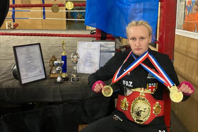 Farrah Cunniff with her championship belt, trophies and medals after a fantastic first year in boxing.