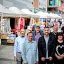 Coun Michael Graham (pictured centre), Wakefield Council's cabinet member for regeneration, with market traders on Teall Street. The council has announced that more stalls will be made available to new traders.