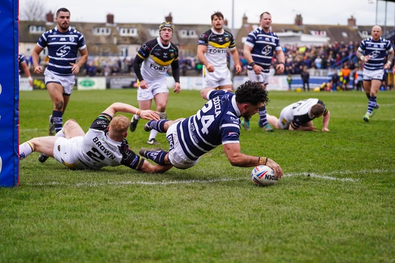 Mathieu Cozza plants the ball down over the line for a Featherstone Rovers try.