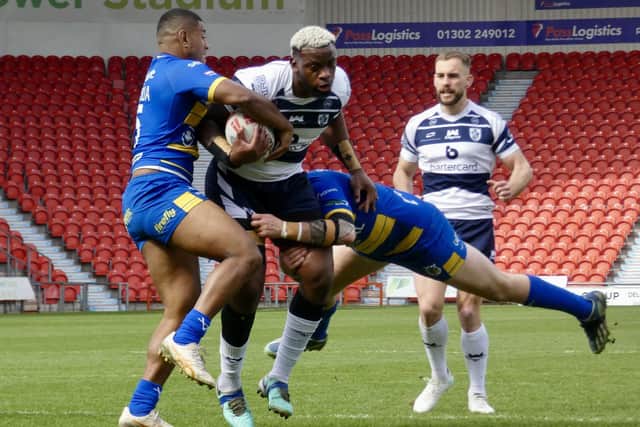 Gadwin Springer takes some stopping for Featherstone Rovers at Doncaster. Picture: Kevin Creighton