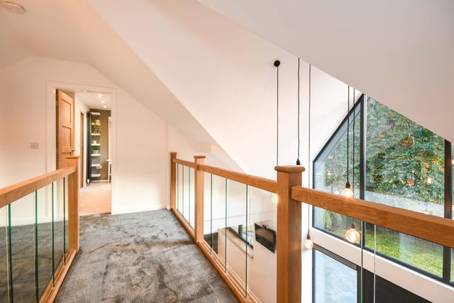 The superb galleried landing overlooks the hallway and floods the house with natural light.