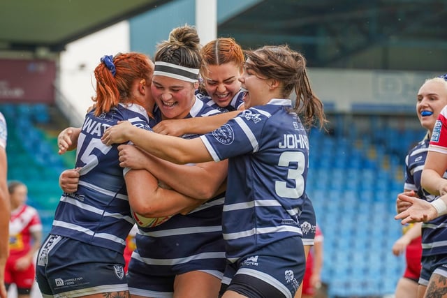 Brogan Churm celebrates scoring her try with Featherstone Rovers teammates.
